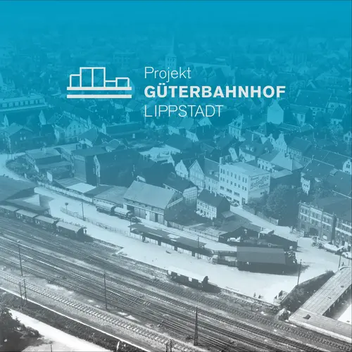 istorische Luftaufnahme des Güterbahnhofs in Lippstadt, überlagert mit einem blauen Farbverlauf und dem Logo sowie Schriftzug "Projekt GÜTERBAHNHOF LIPPSTADT".