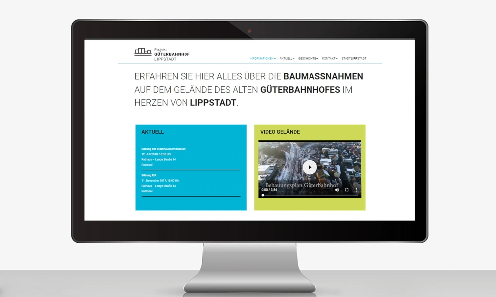 Computerbildschirm zeigt eine Website über Baumaßnahmen am alten Güterbahnhof in Lippstadt mit Text und Video-Vorschau.