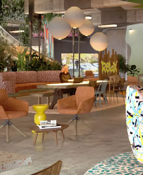 Moderner Lounge-Bereich bei 'Happy Franky' mit bequemen Sesseln, farbenfrohen Mustern, Pflanzen und Schriftzug 'Relax' im Hintergrund.
