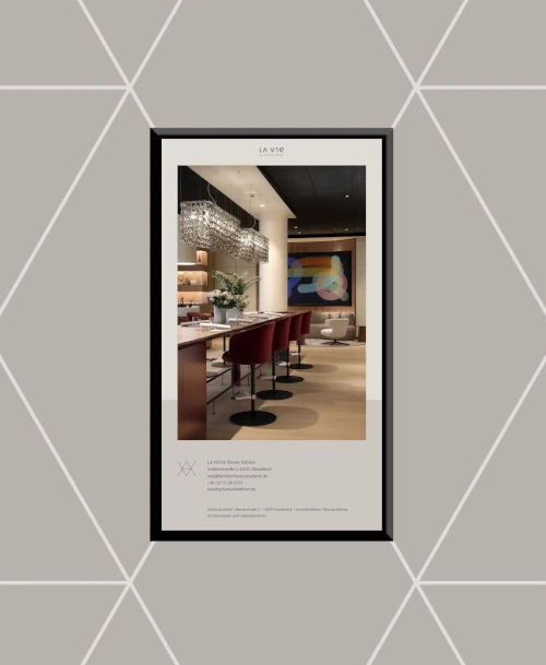 Design-Weinbar im LA VIE by Thomas Bühner in Düsseldorf mit rundem Holztresen, stilvoller Beleuchtung und moderner Kunst.